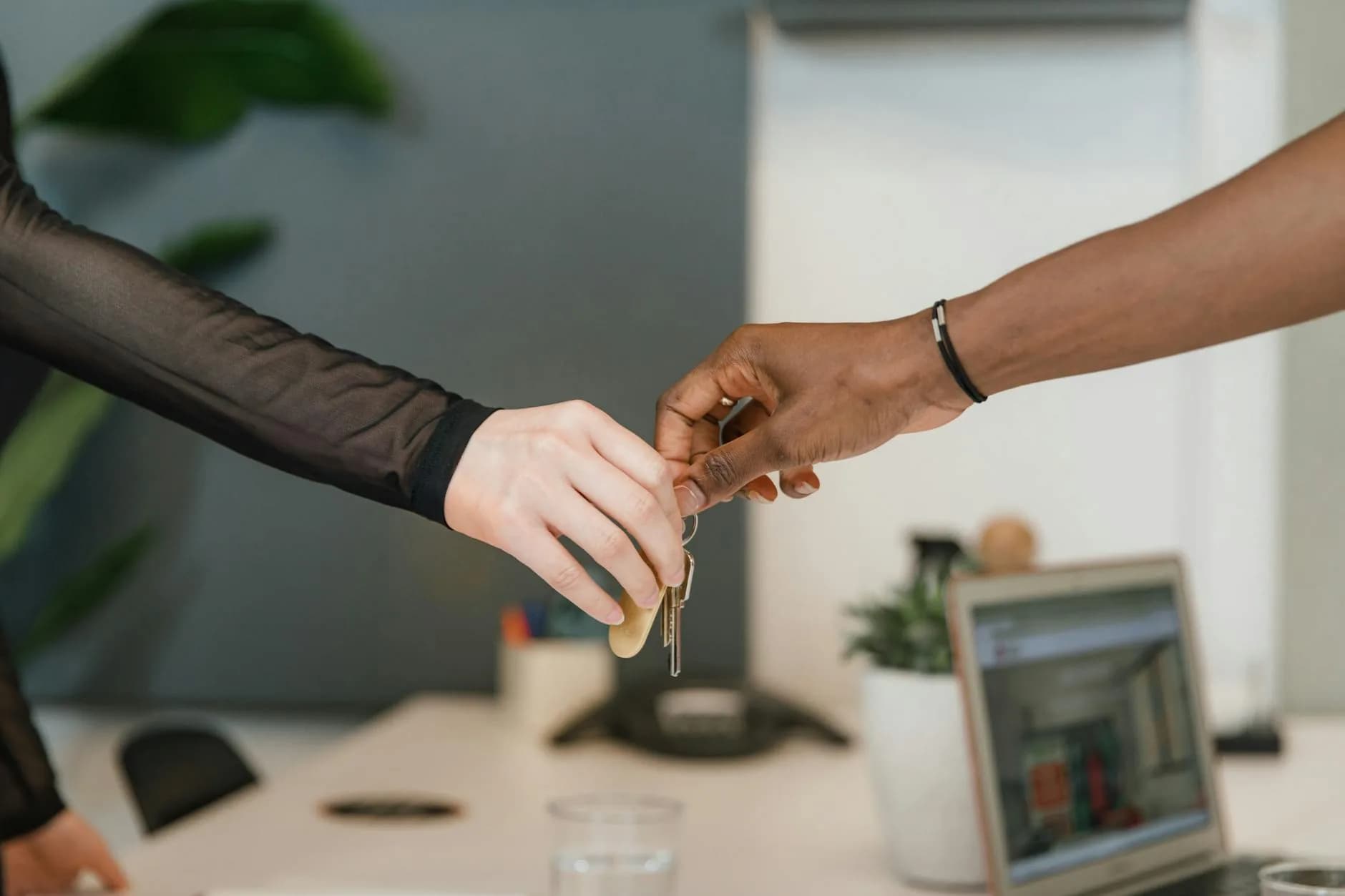 Car keys handover at a garage service reception desk