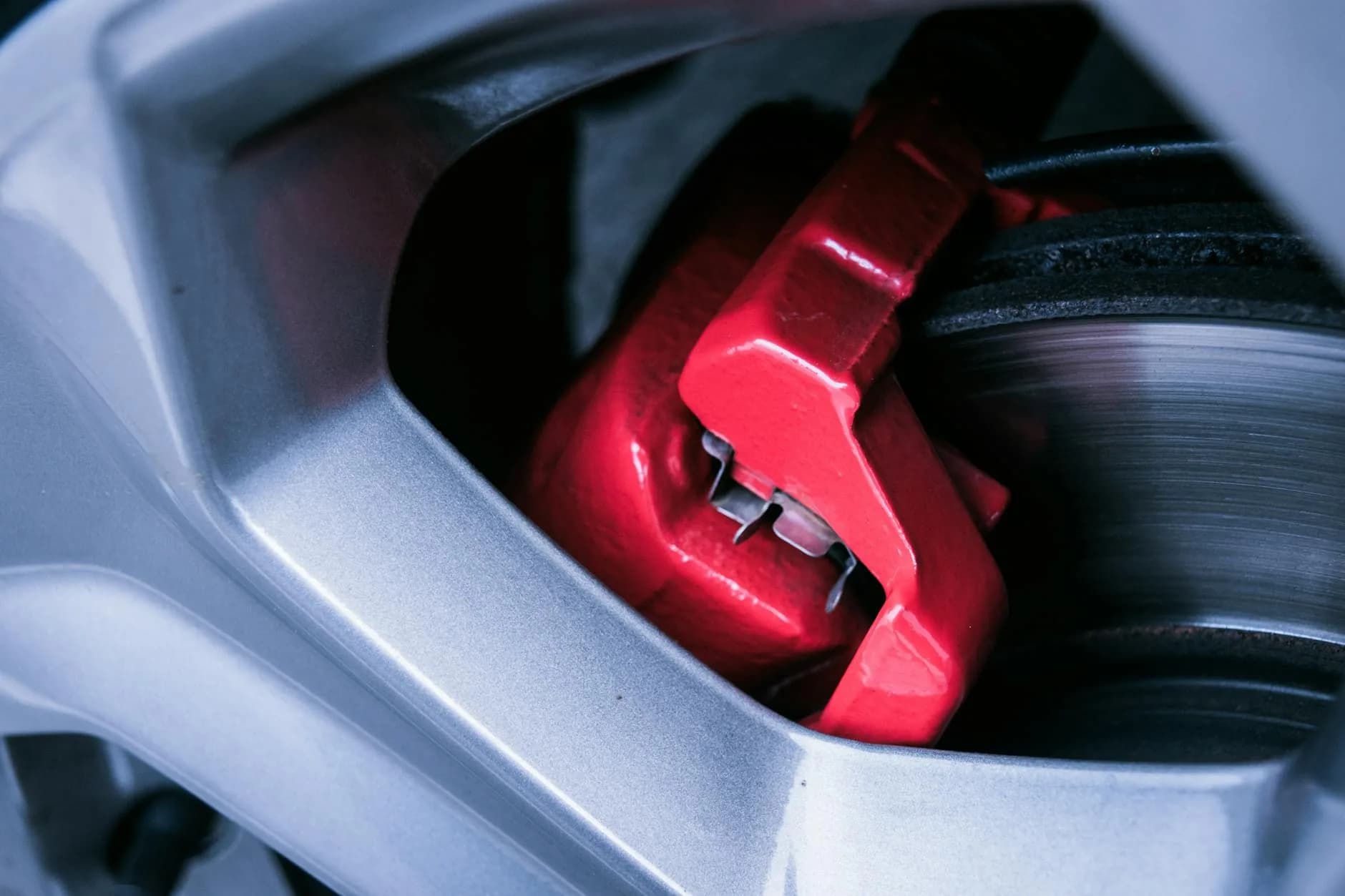 Close-up of a brake disc and caliper during brake repair