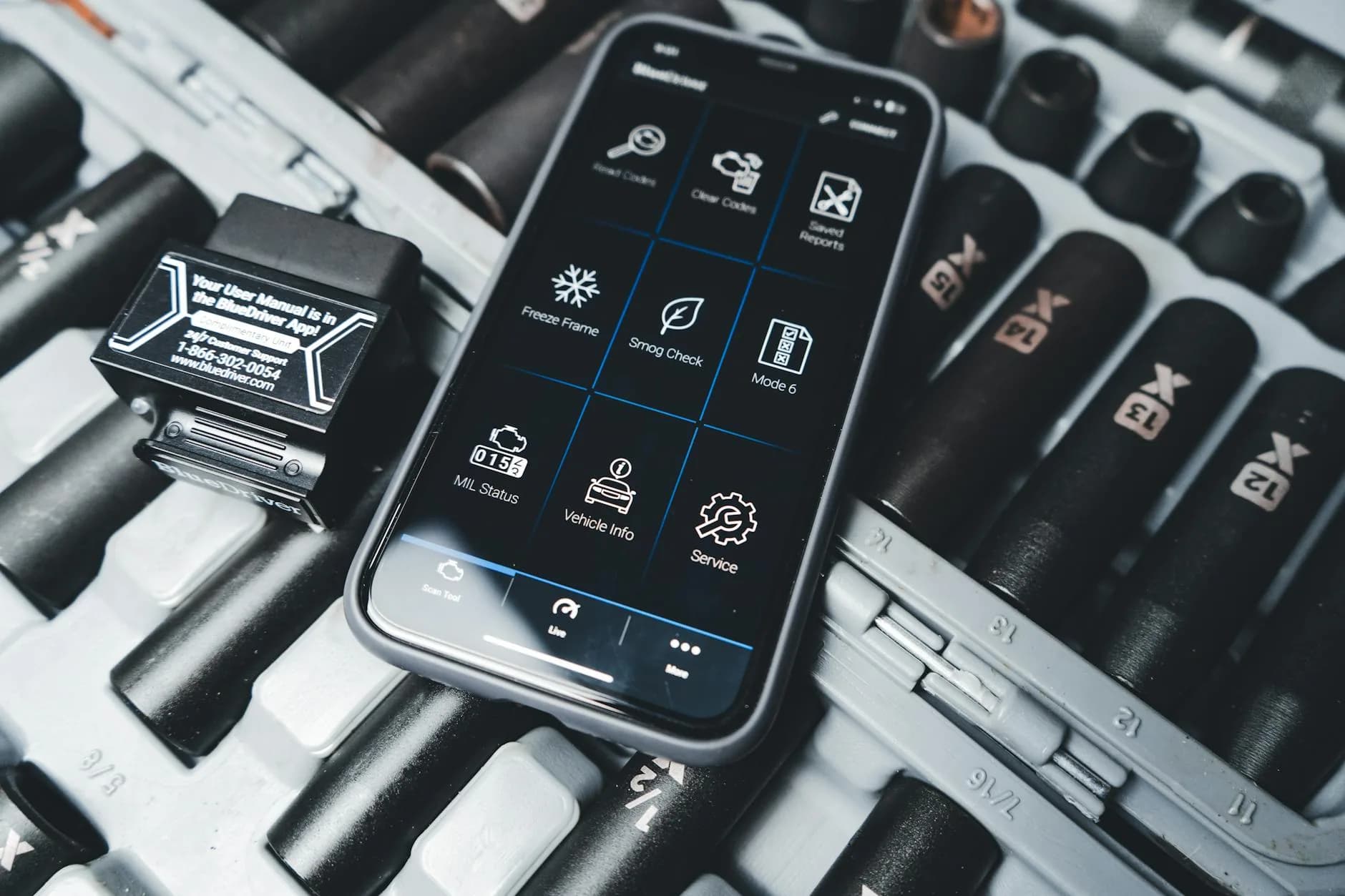 Diagnostic scanner connected to a vehicle for fault code reading
