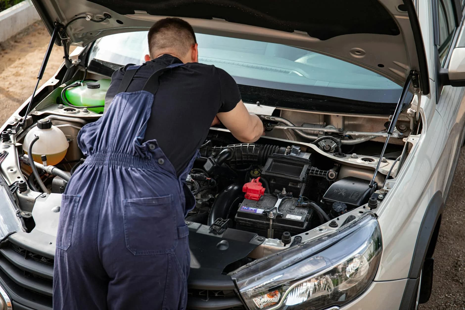Mechanic working on a car engine at Bedlington MOT and Service Centre